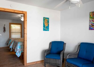 Living room area with rattan chair and love seat