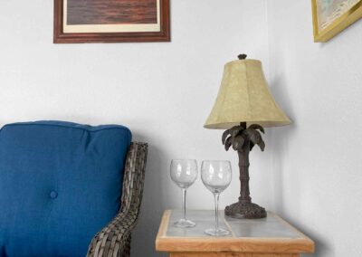 Room 4 seating area showing table with two wine glasses and lamp