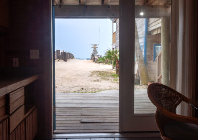 Room 6 - view out the door onto the beach in front of Sandollar Sity