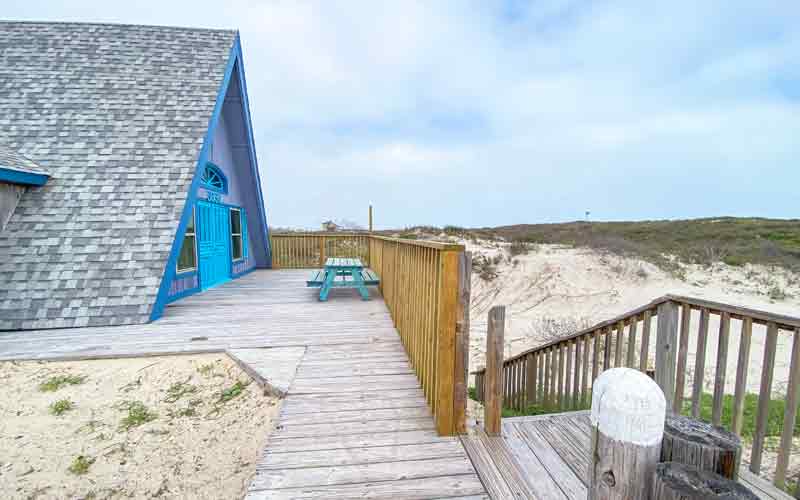 Outside of Room 10 - buildimng is an A-frame with front painted blue