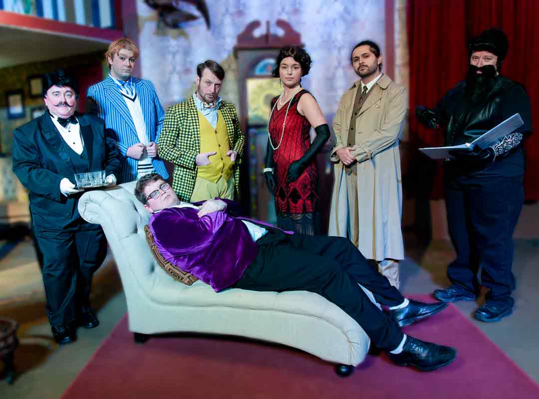 PACT cast on stage in costumes for The Play That Goes Wrong