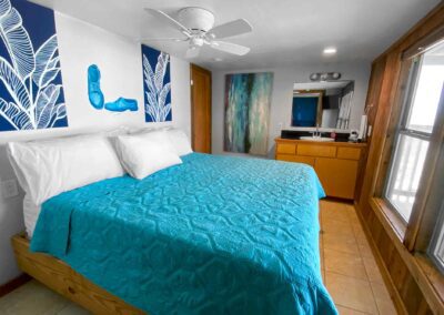 King size bed with turquoise bed spread