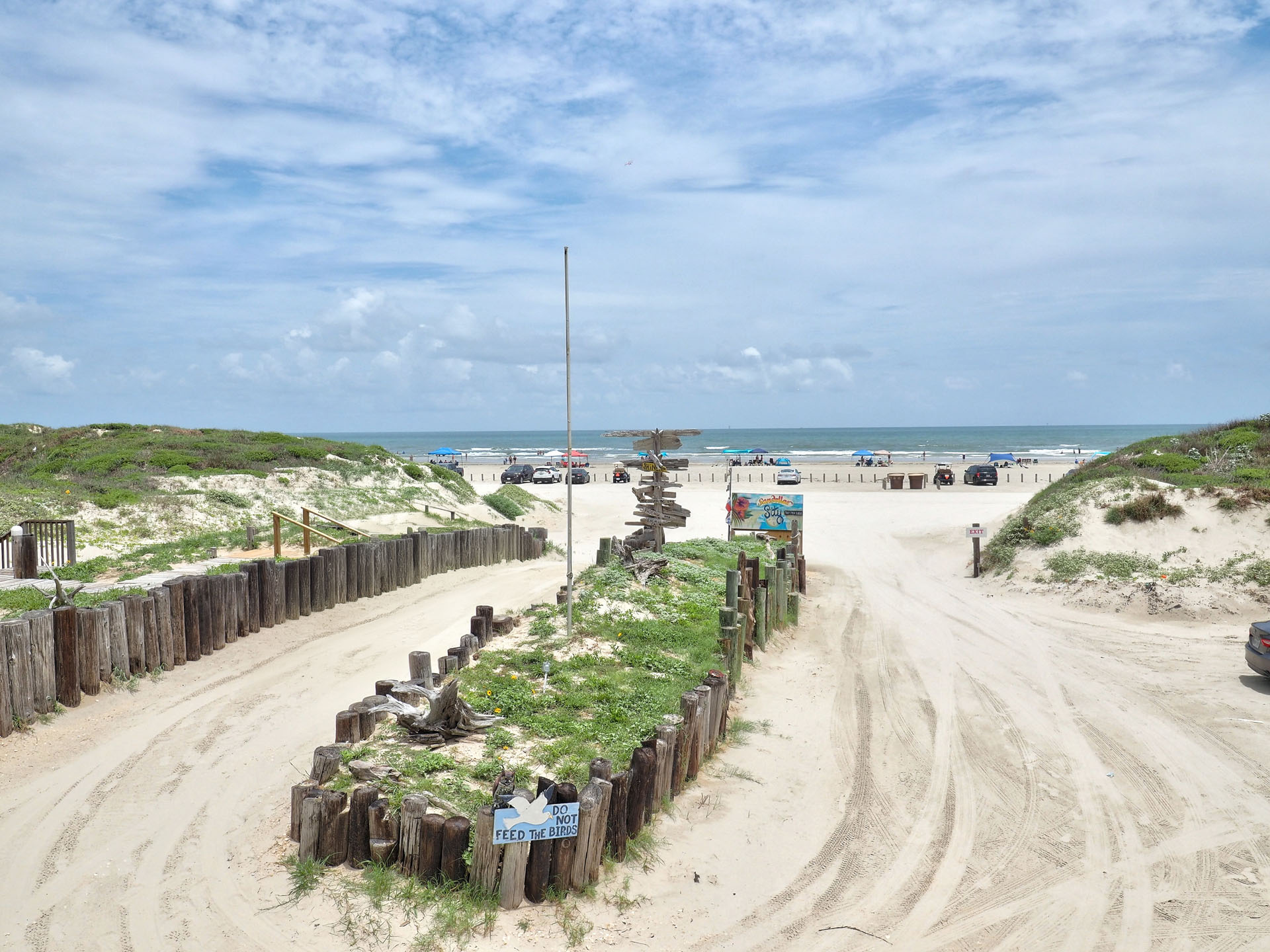 Port Aransas Beachfront Rental - Beach and blue sky as seen from the patio of Unit 1
