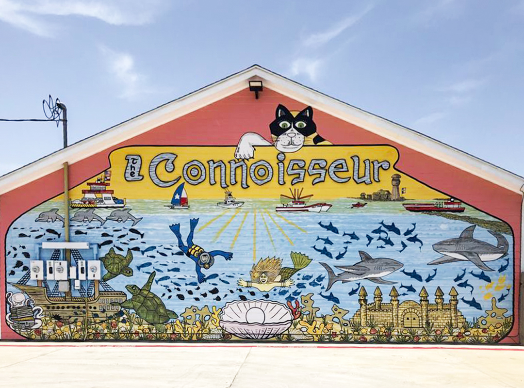 Colorful mural on the side of The Connoisseur