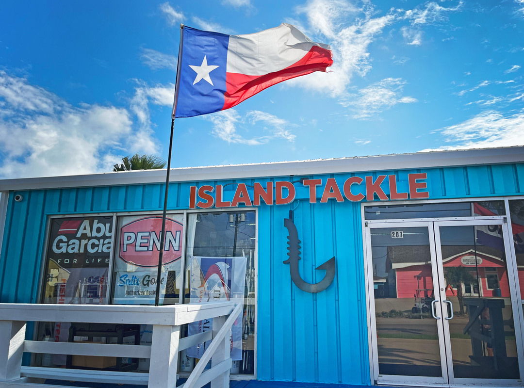 Island Tackle building with Texas Flag in front