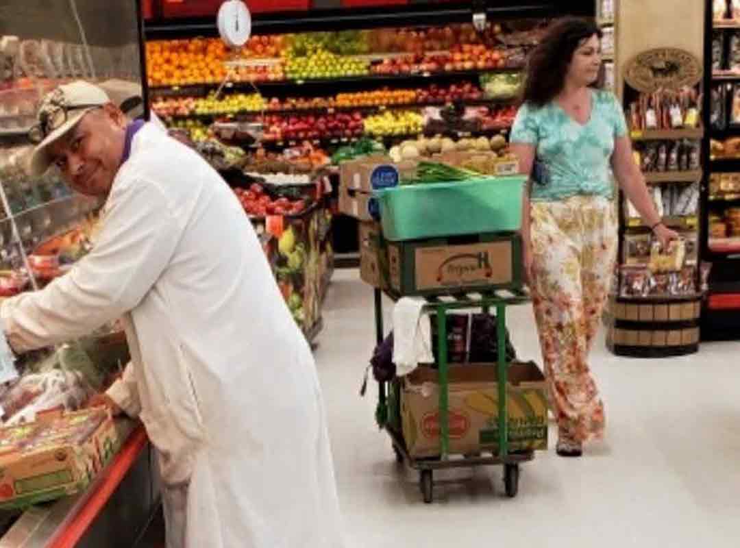 People in produce section of Lowe's Family Center